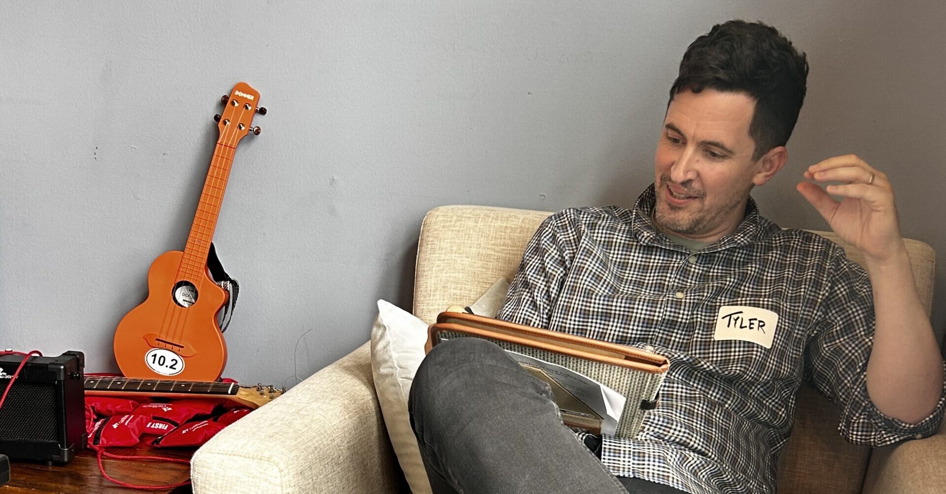 Tyler teaching a songwriting session.